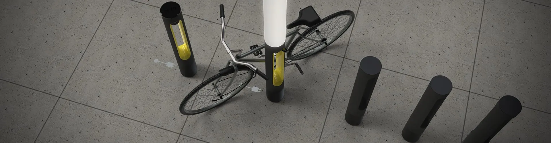 Breite Vogelperspektive auf ein Fahrrad, das an einer SMARTPOLE-Ladestation zwischen schlichten Poller gesichert ist